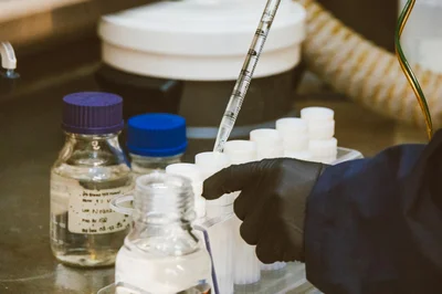 Detailed view of laboratory equipment and pipette in use, enhancing scientific research.